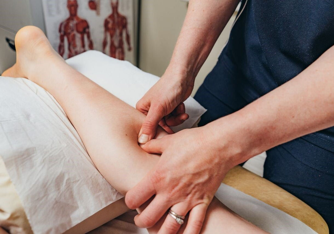 Physiotherapist performing manual therapy on a patient's shoulder to relieve pain, improve mobility, and promote faster recovery at Health Plus Physiotherapy Clinic